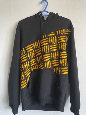 Upcycled Black Hoodie with Ankara Orange Pattern accent.